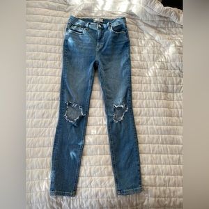 Free People skinny jeans with holes in knees